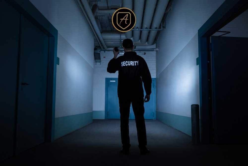 Alexios Security Solutions agent conducts a security patrol in a stadium hallway to ensure event safety and protection.