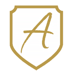 The White-Shield-Logo shows a gold shield outline with an elegant handwritten letter A centered on a white background, symbolizing Executive Protection & Bodyguards in Las Vegas by Alexios Security Solutions.