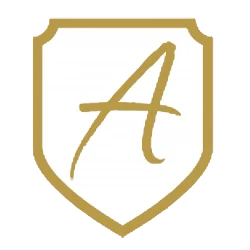 The White-Shield-Logo shows a gold shield outline with an elegant handwritten letter A centered on a white background, symbolizing Executive Protection & Bodyguards in Las Vegas by Alexios Security Solutions.