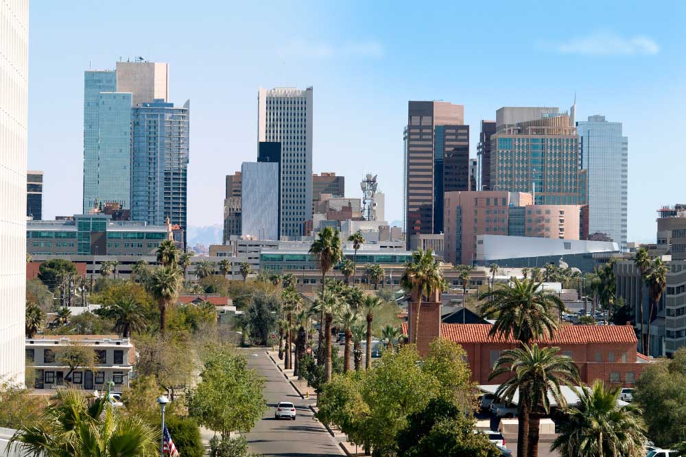 Reno’s skyline features modern high-rises, palm-lined streets, and a clear blue sky; in the foreground, greenery and low-rise buildings benefit from enhanced security with Alexios-security-solutions-phoenix-arizona. Reno’s skyline features modern high-rises, palm-lined streets, and a clear blue sky; in the foreground, greenery and low-rise buildings benefit from enhanced security with Alexios-security-solutions-phoenix-arizona.