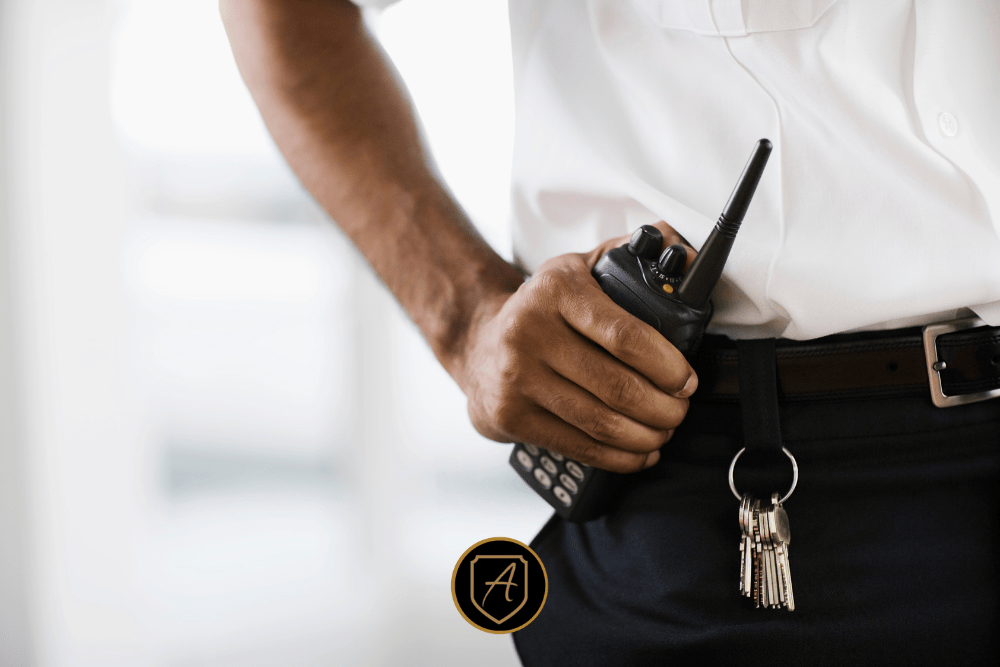 A security guard holds a walkie-talkie and has keys on their belt while providing protection at a public holiday outreach event, shown in sharp focus for "Community Event Security During Holiday Outreach Events_ Protecting Nonprofits and Public Gatherings2". | Executive Protection & Bodyguards in Las Vegas | Alexios