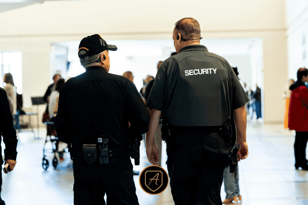 Security officers monitoring crowds in a public space, demonstrating holiday event safety by Alexios Security Solutions