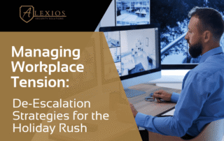 Security professional reviewing surveillance monitors for workplace safety planning during peak season by Alexios Security Solutions