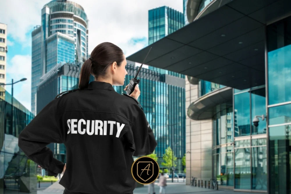 Discreet professional security agent positioned near a modern office entrance